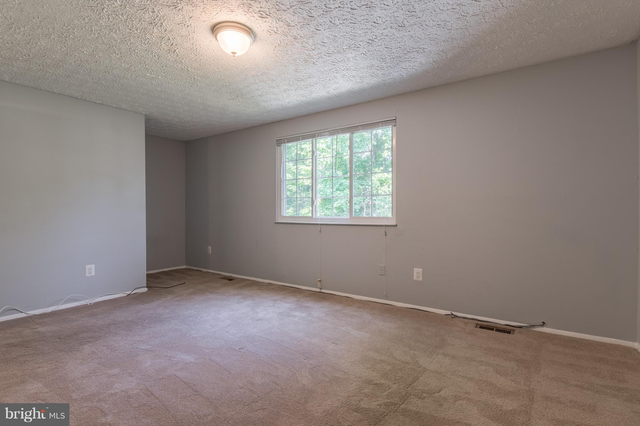8334 Windfall Road Springfield, VA 22153 - Photo 12 of 16 an empty room with a window