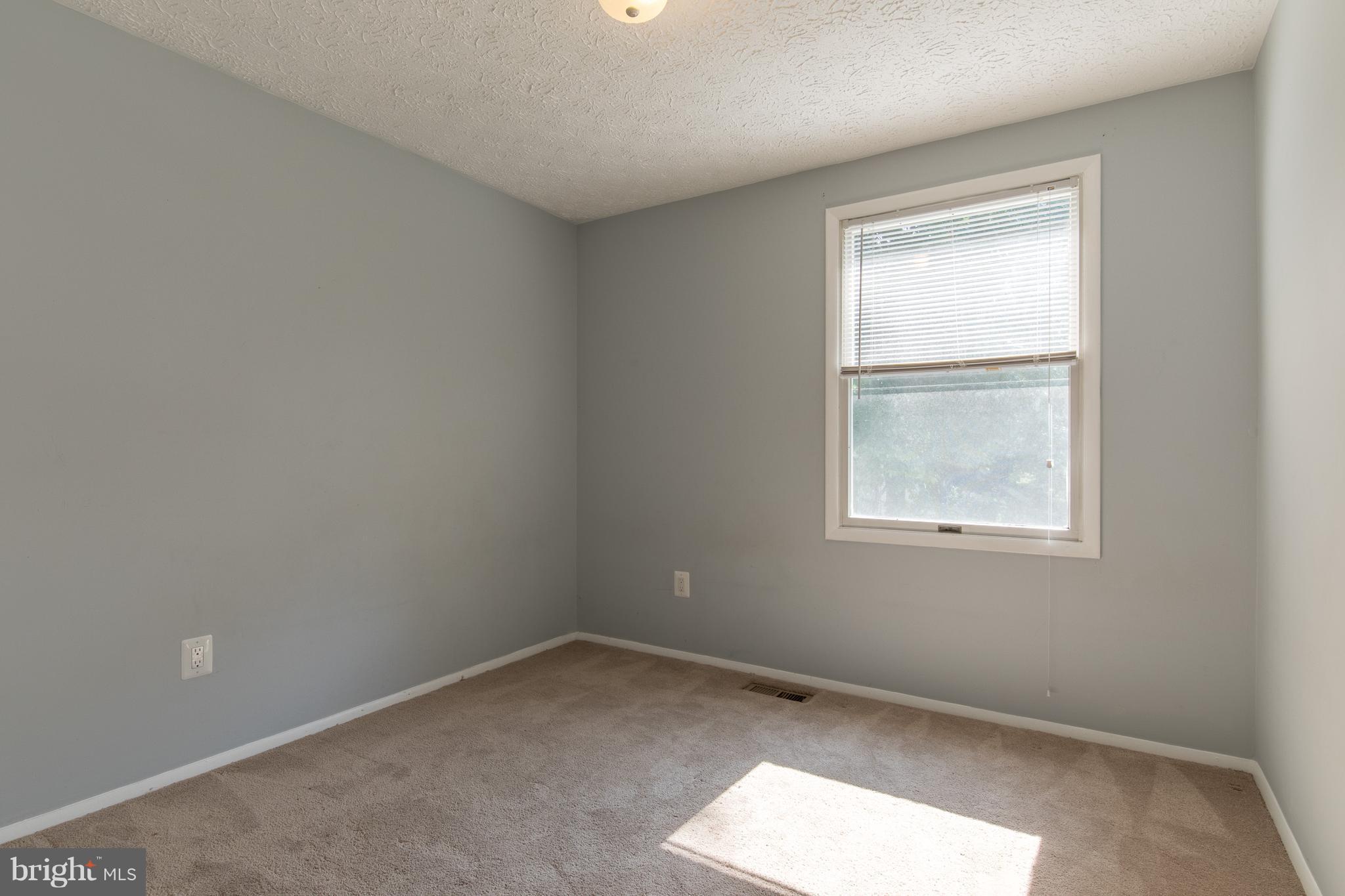 8334 Windfall Road Springfield, VA 22153 - Photo 14 of 16 an empty room with a window