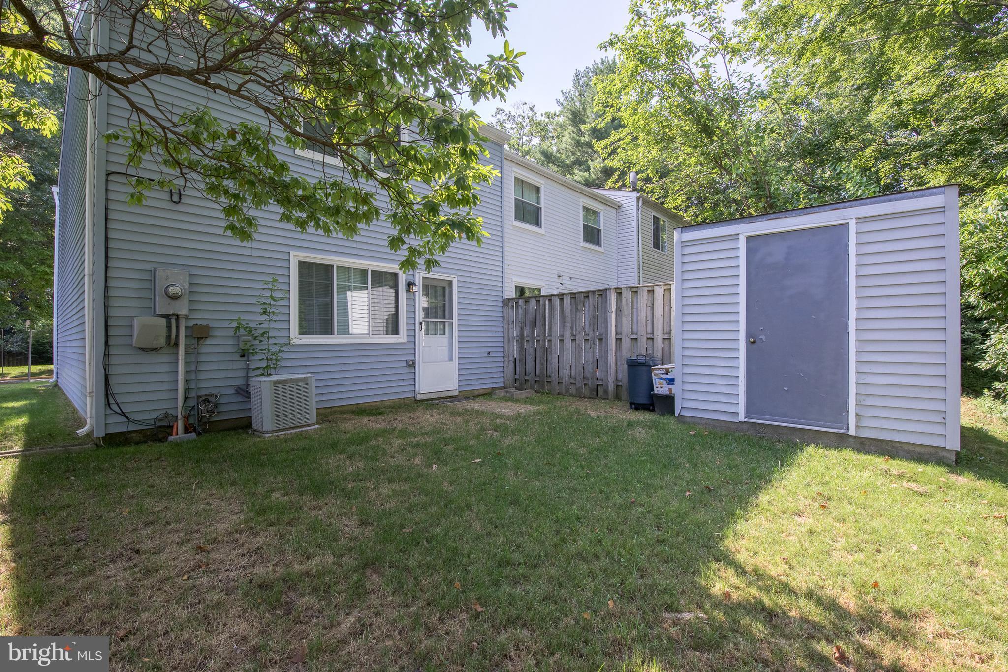 8334 Windfall Road Springfield, VA 22153 - Photo 2 of 16 a view of a backyard with a small cabin