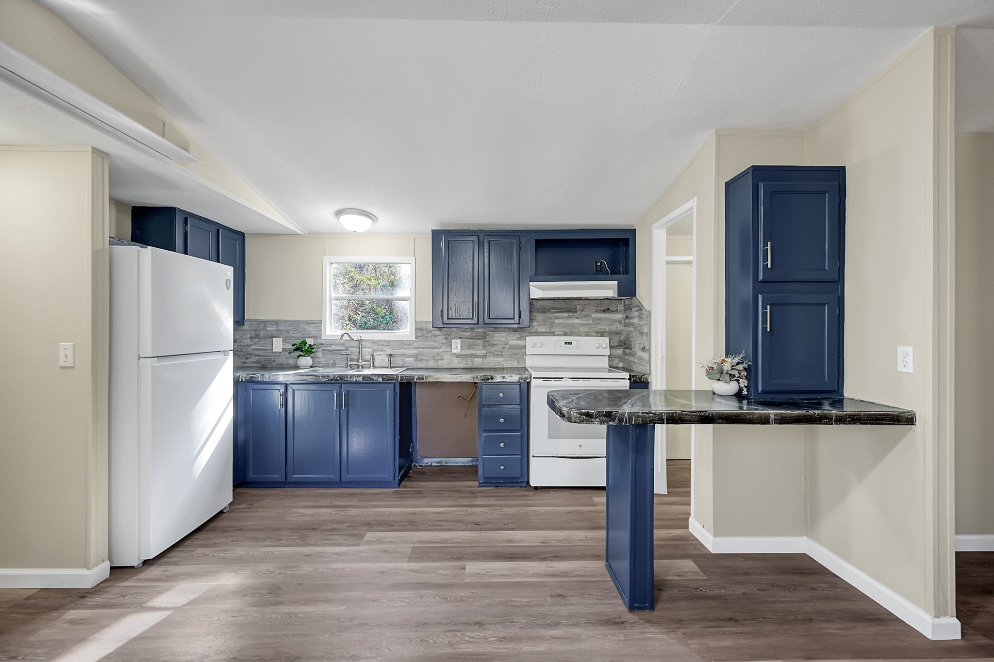 13219 13th Street, Unit A Splendora, TX 77372 - Photo 13 of 19 Your kitchen is ready for you to make your favorite meals as you gaze out into the wooded area behind it.