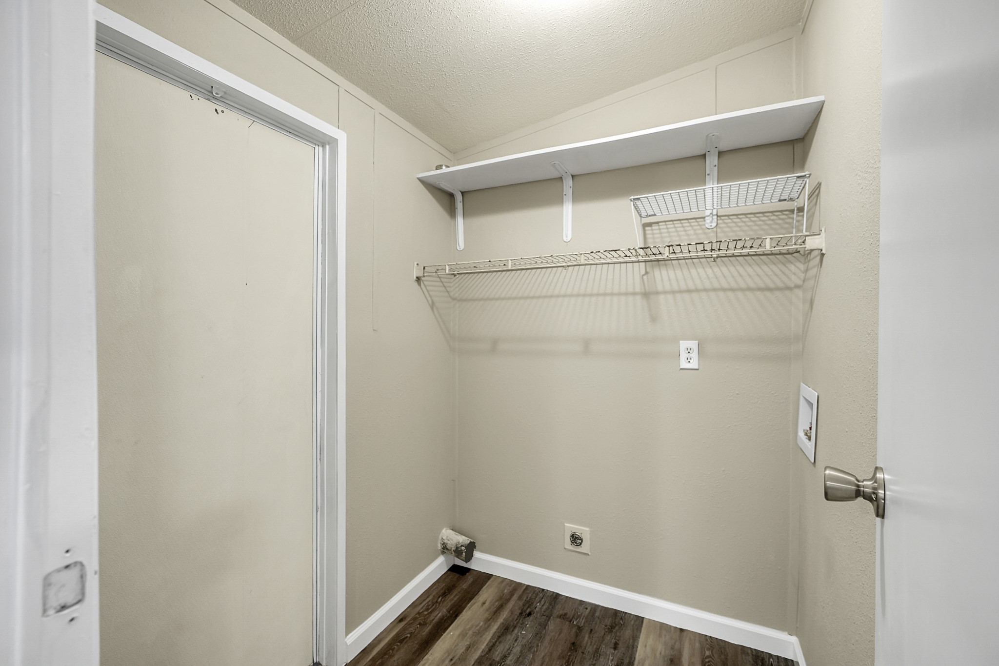 13219 13th Street, Unit A Splendora, TX 77372 - Photo 14 of 19 Just off your kitchen is the laundry room and access to your back patio. Now let's go check out your primary bedroom before we head outside.