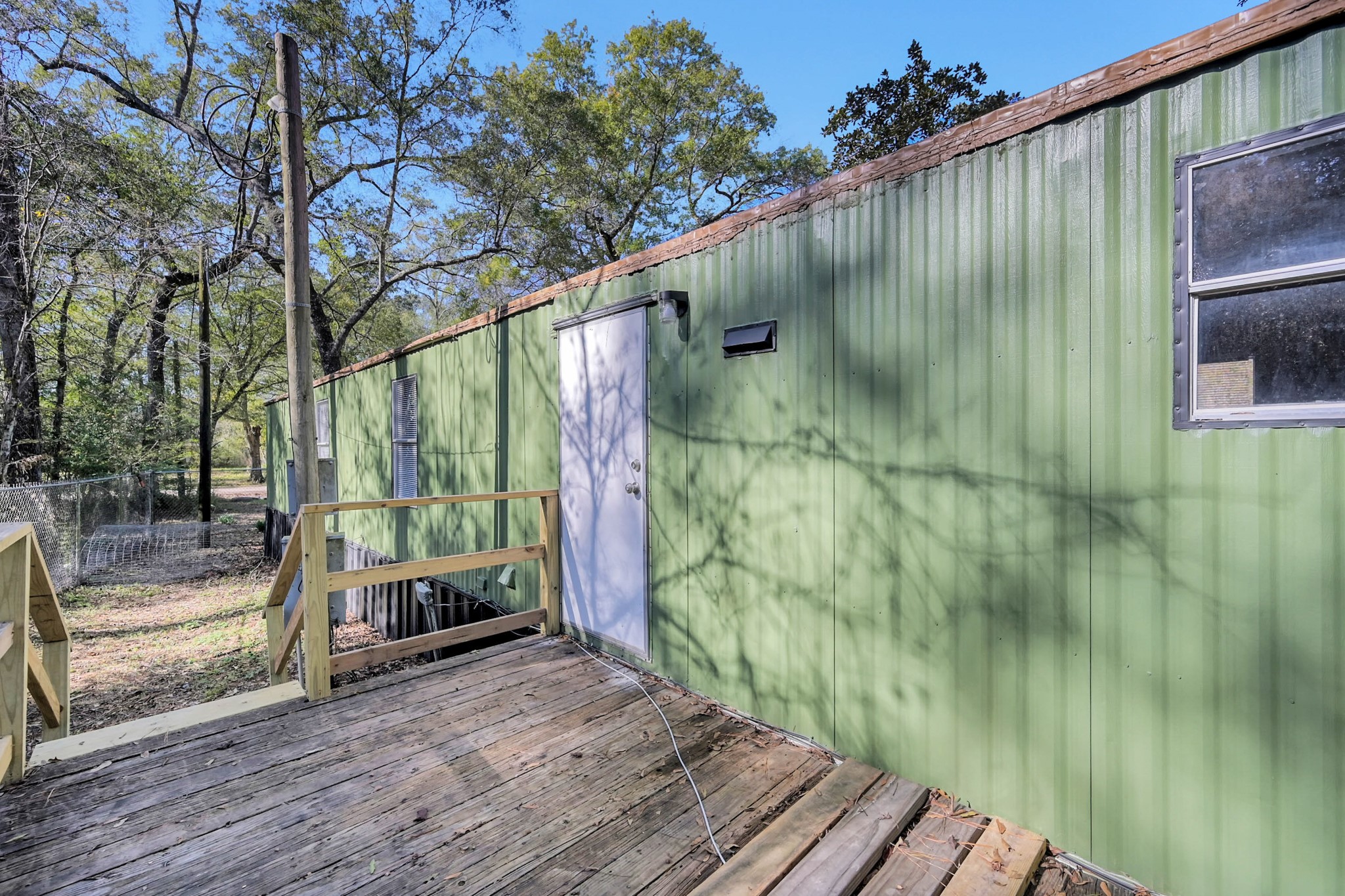 13219 13th Street, Unit A Splendora, TX 77372 - Photo 17 of 19 Now let's check out your back porch that has a beautiful wooded view.