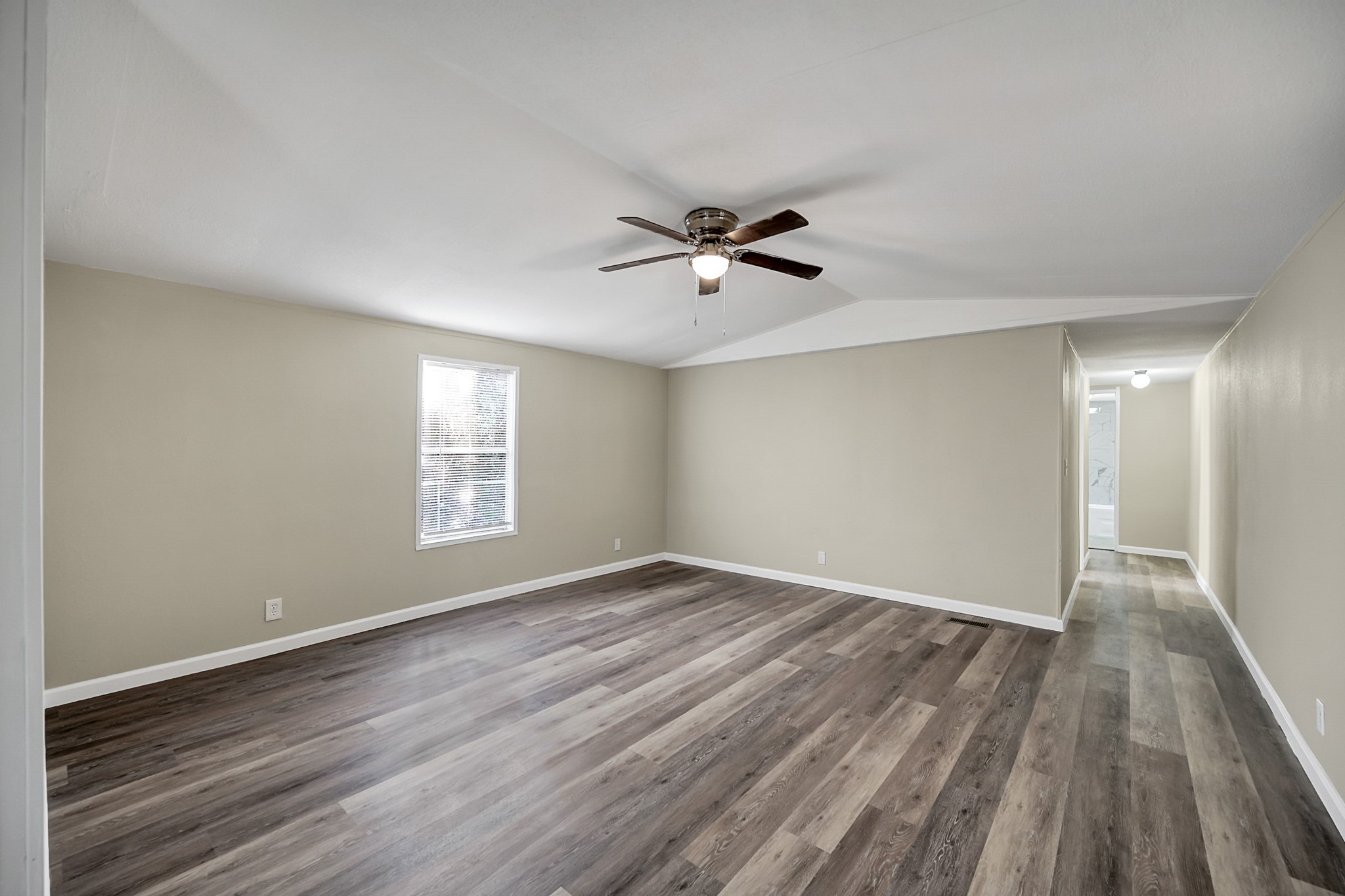 13219 13th Street, Unit A Splendora, TX 77372 - Photo 6 of 19 Your living room can fit even the largest of furniture with ease. Notice the beautiful vinyl plank throughout the home giving you that low maintenance lifestyle you're looking for.