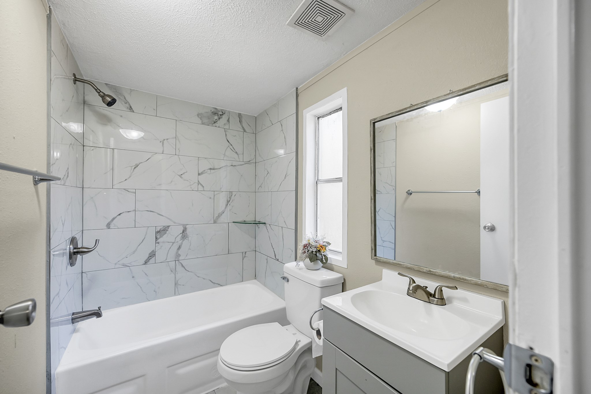 13219 13th Street, Unit A Splendora, TX 77372 - Photo 9 of 19 Between the secondary bedrooms, you'll find a full bathroom with modern updates.
