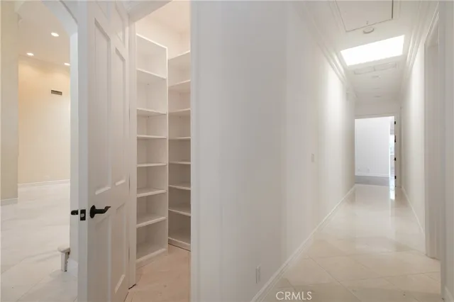 a view of closet area with empty racks