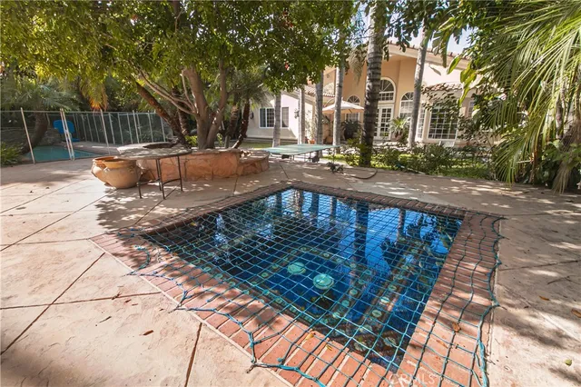 a view of a swimming pool with a patio