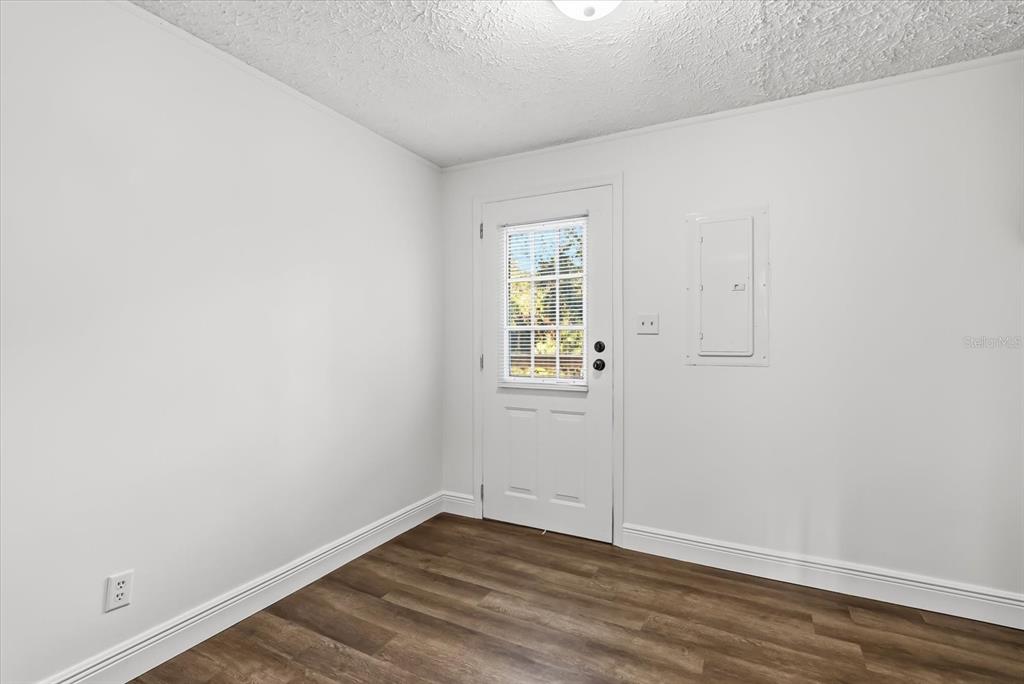 1785 Marsh Way Geneva, FL 32732 - Photo 24 of 40 an empty room with wooden floor and windows