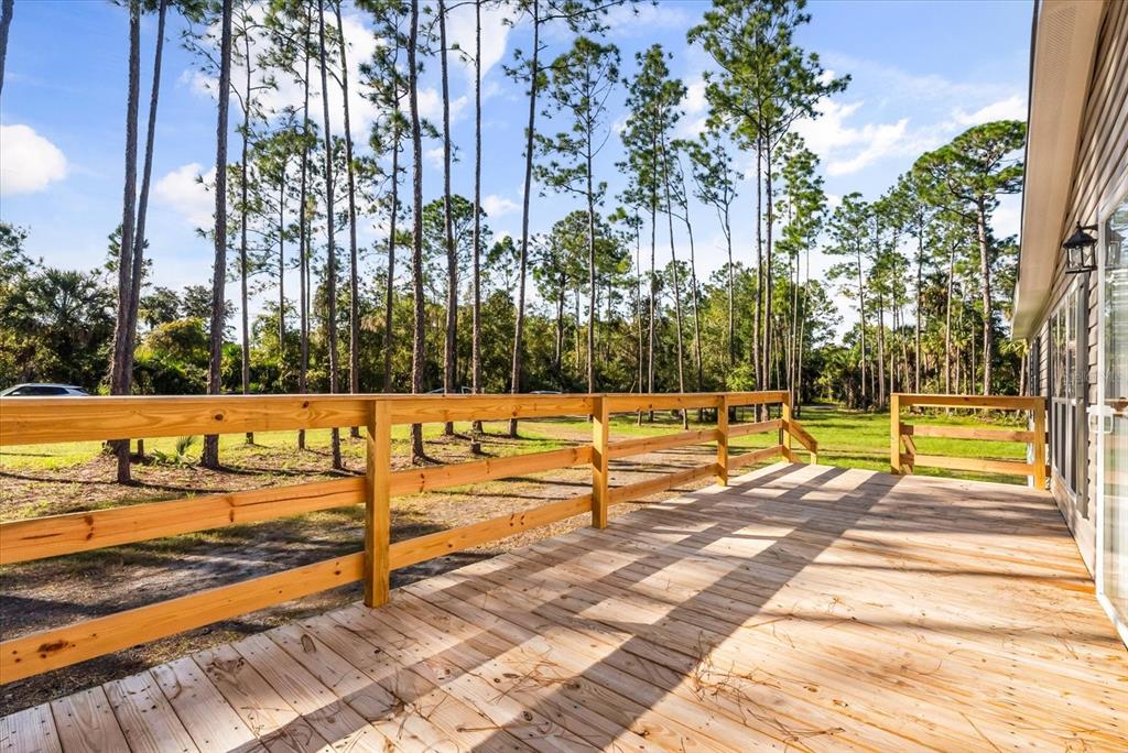 1785 Marsh Way Geneva, FL 32732 - Photo 10 of 40 a view of a swimming pool with an outdoor seating and yard