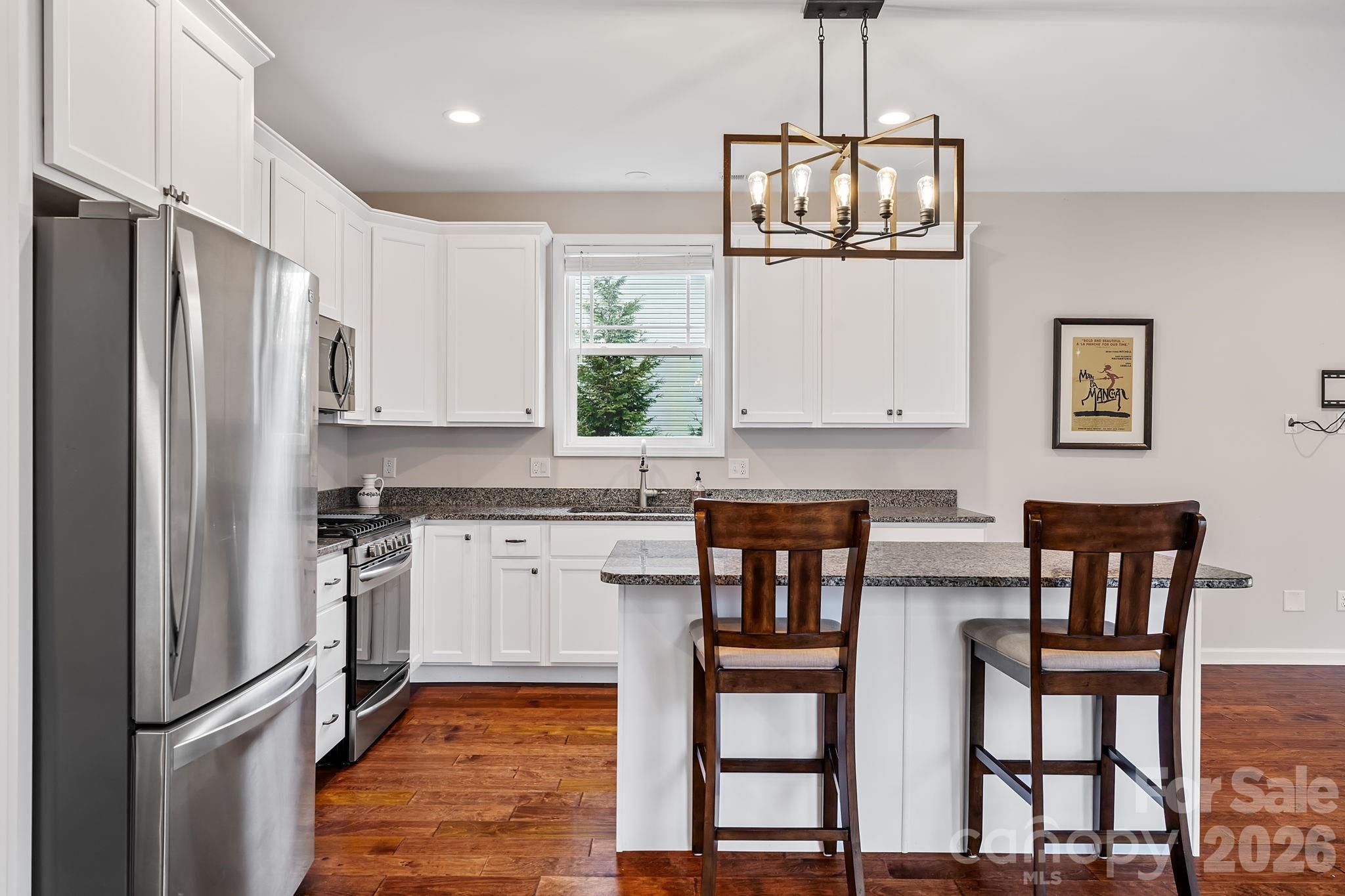 57 Parrot Road Candler, NC 28715 - Photo 13 of 44 a kitchen with stainless steel appliances granite countertop a refrigerator and a stove top oven