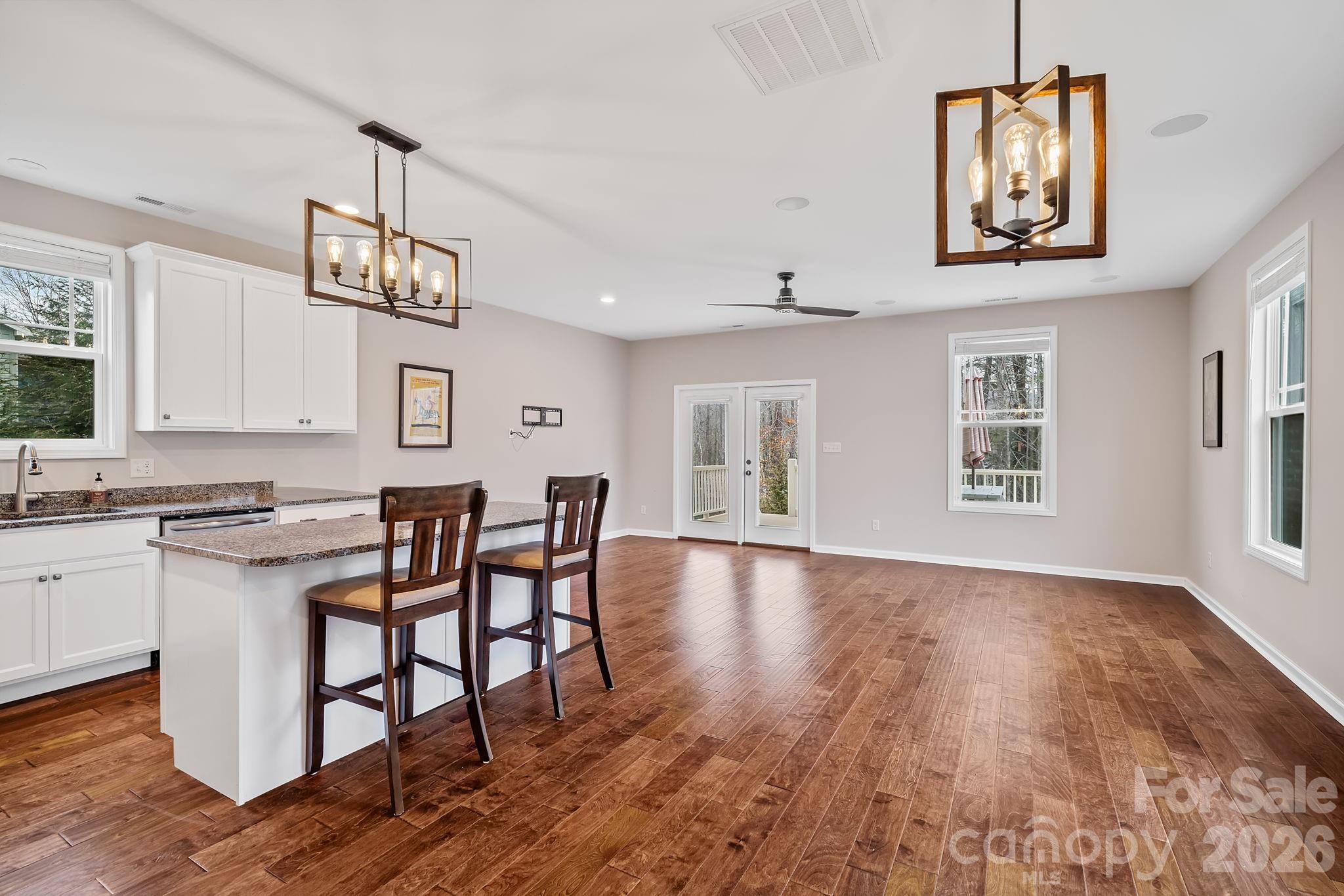 57 Parrot Road Candler, NC 28715 - Photo 14 of 44 a view of a dining room with furniture window and wooden floor