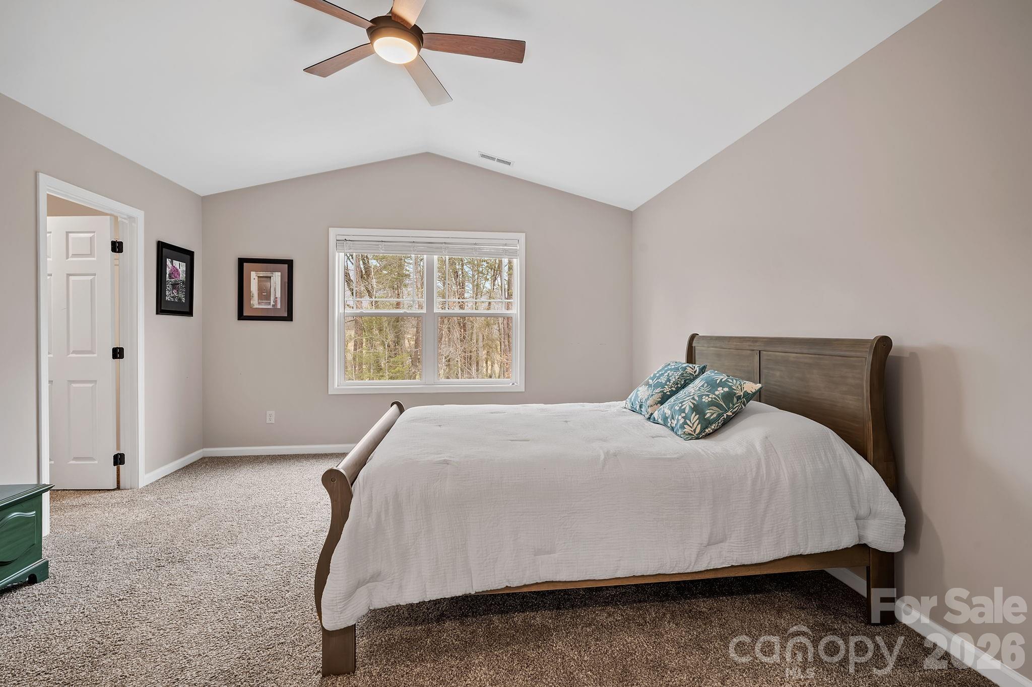 57 Parrot Road Candler, NC 28715 - Photo 20 of 44 a bedroom with a bed and window