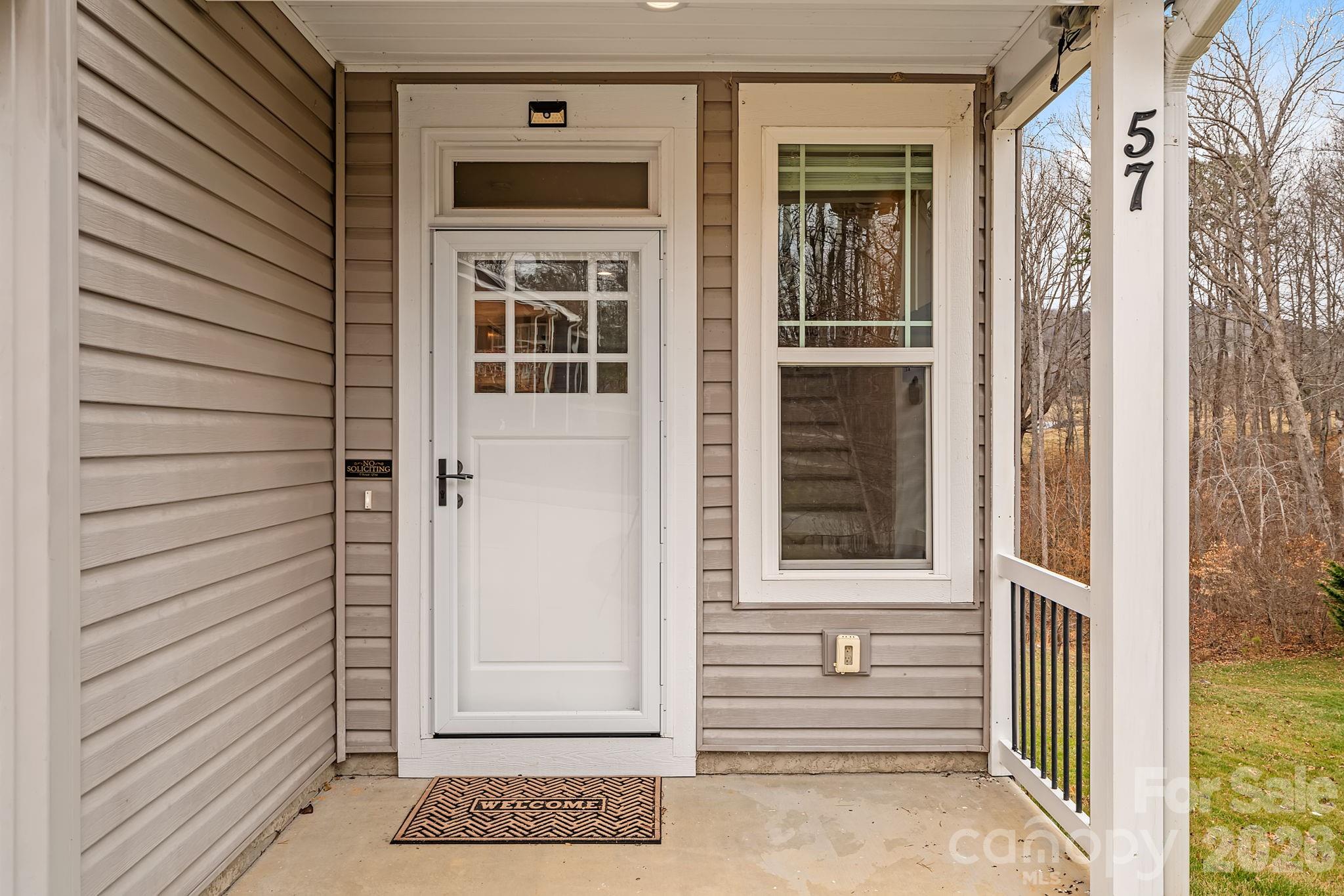 57 Parrot Road Candler, NC 28715 - Photo 3 of 44 a view of entrance door of the house