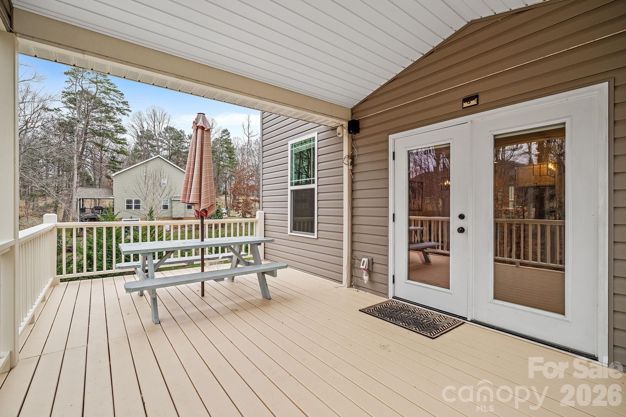 57 Parrot Road Candler, NC 28715 - Photo 31 of 44 a balcony with furniture and wooden floor