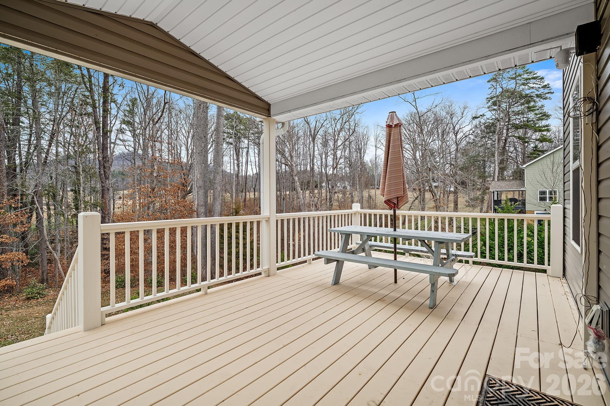 57 Parrot Road Candler, NC 28715 - Photo 32 of 44 a view of a wooden deck with furniture