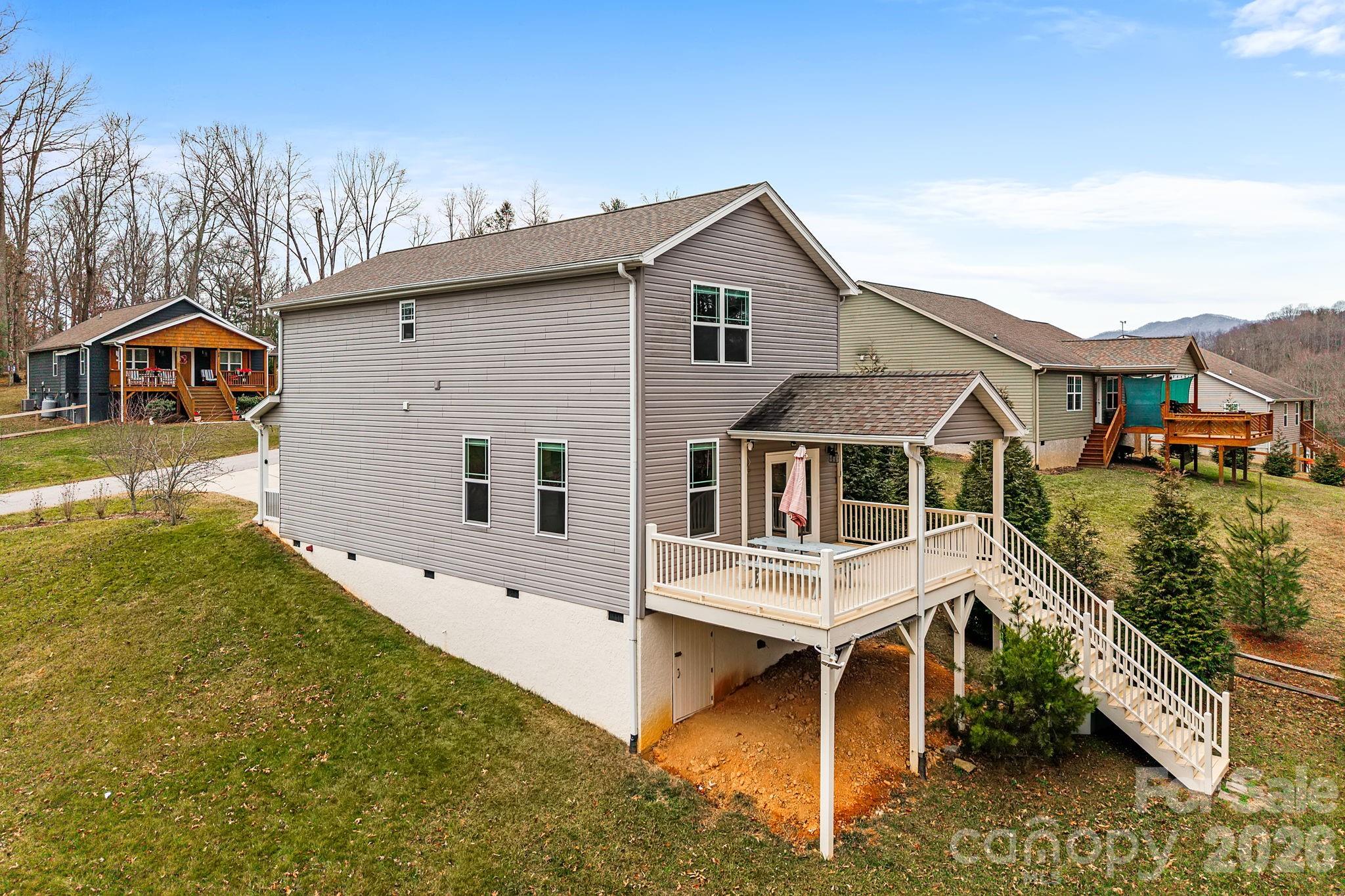 57 Parrot Road Candler, NC 28715 - Photo 38 of 44 a front view of a house with a yard