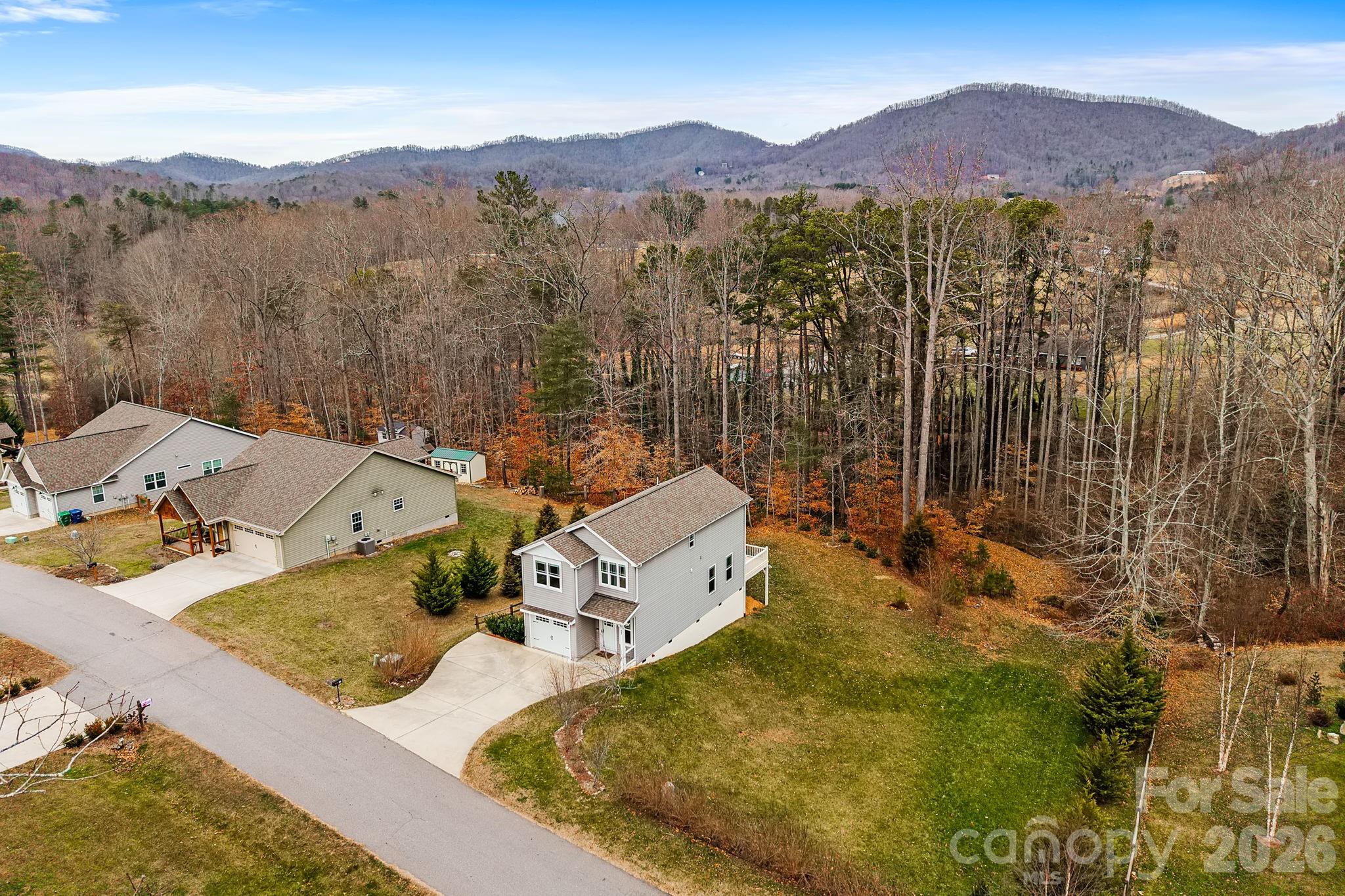 57 Parrot Road Candler, NC 28715 - Photo 40 of 44 a view of a house with a yard and mountain