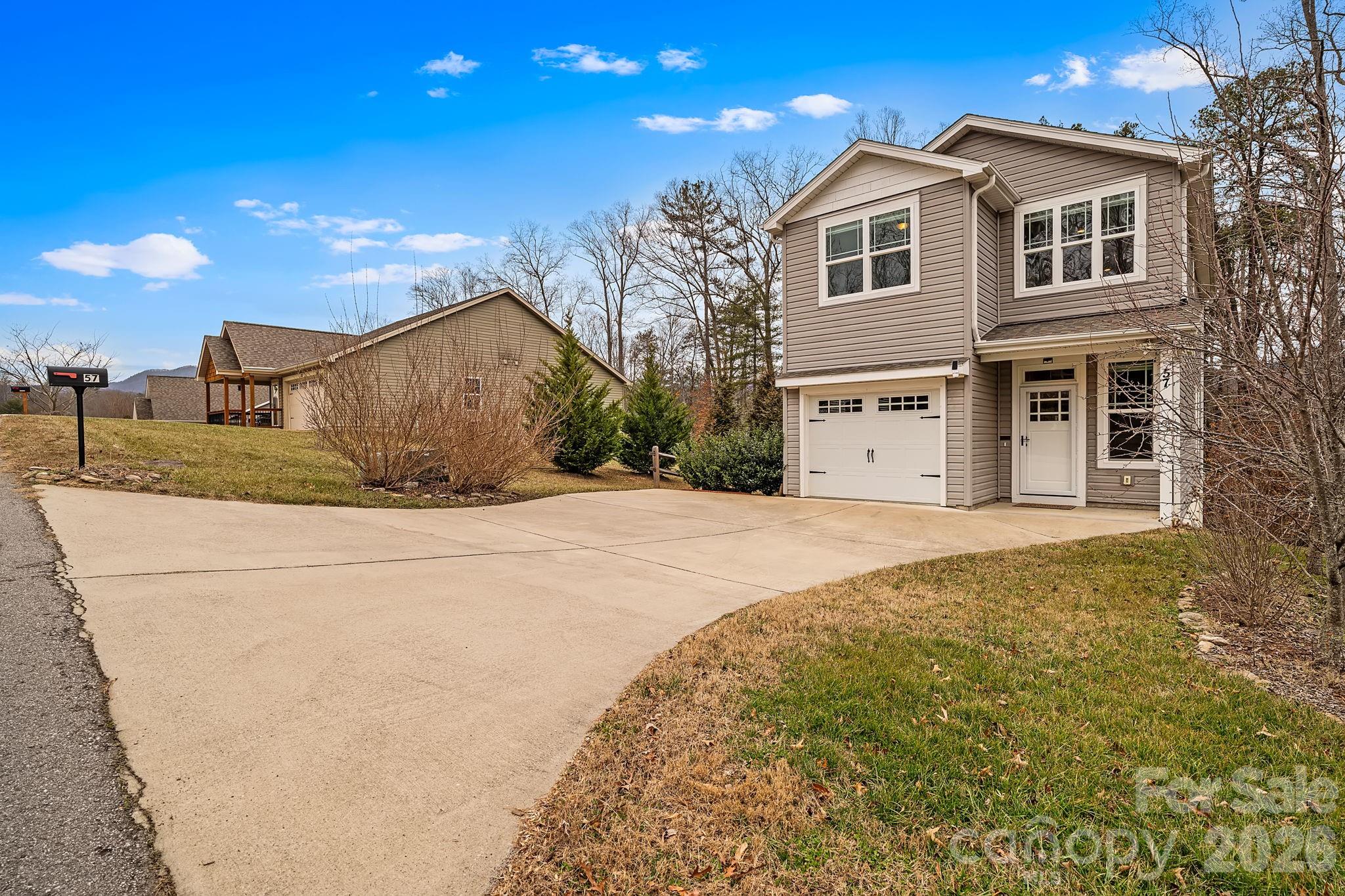 57 Parrot Road Candler, NC 28715 - Photo 43 of 44 a front view of a house with a yard