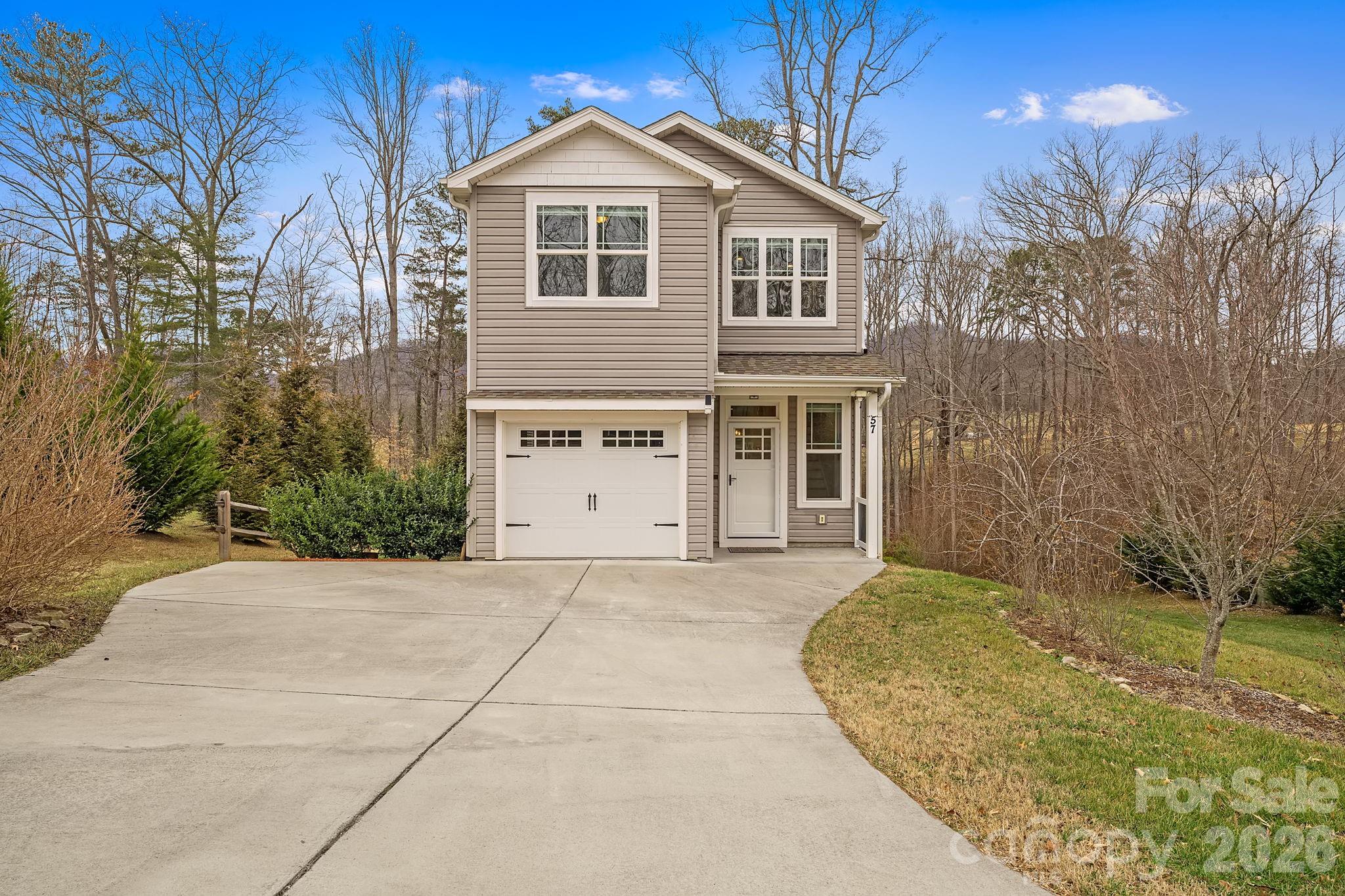 57 Parrot Road Candler, NC 28715 - Photo 44 of 44 a front view of a house with a yard