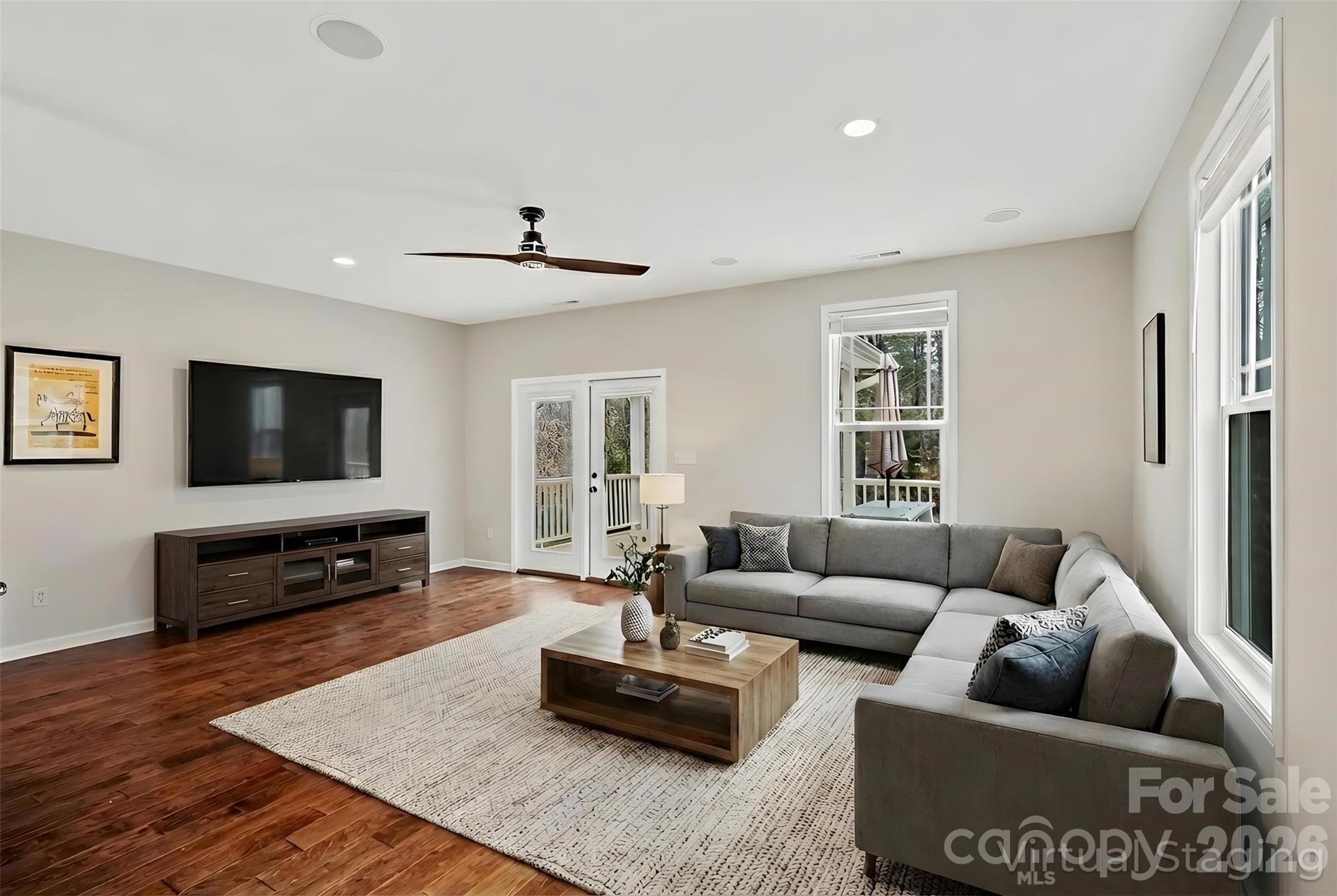 57 Parrot Road Candler, NC 28715 - Photo 5 of 44 a living room with furniture and a flat screen tv