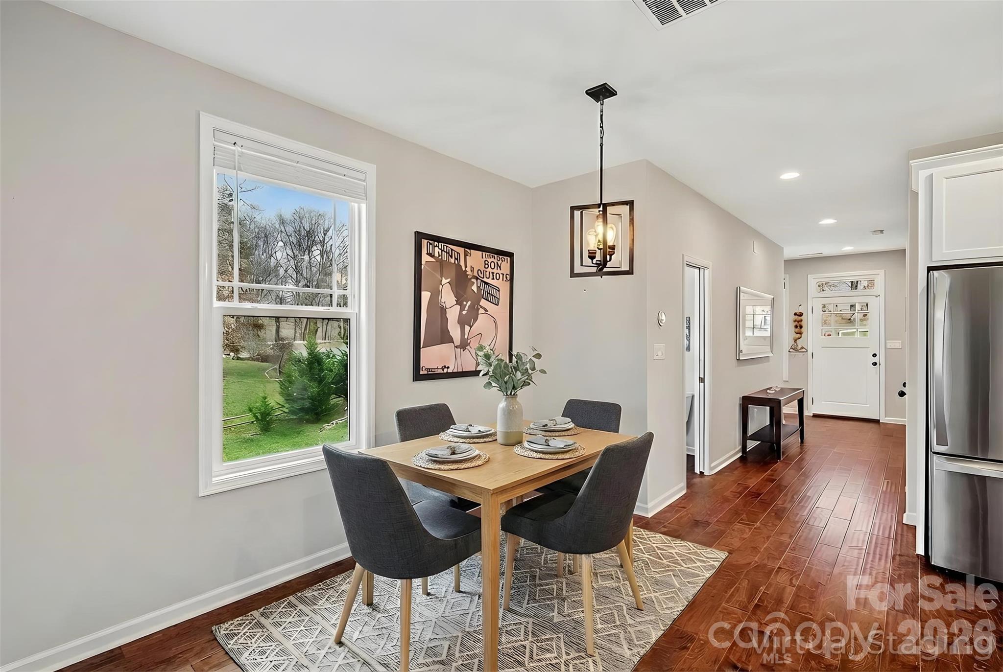 57 Parrot Road Candler, NC 28715 - Photo 6 of 44 a view of a dining room with furniture window and wooden floor