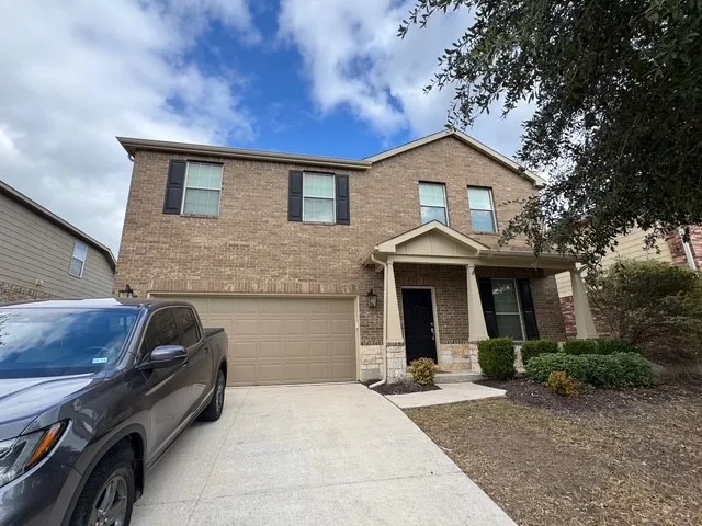 a front view of a house with garage