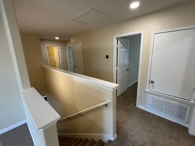 a view of a hallway with entryway