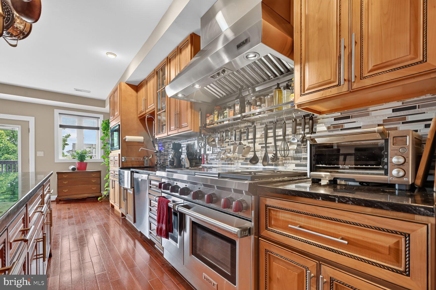 507 M Street Northeast, Unit 2 Washington, DC 20002 - Photo 6 of 27 Wolf professional range with four burners, a grill