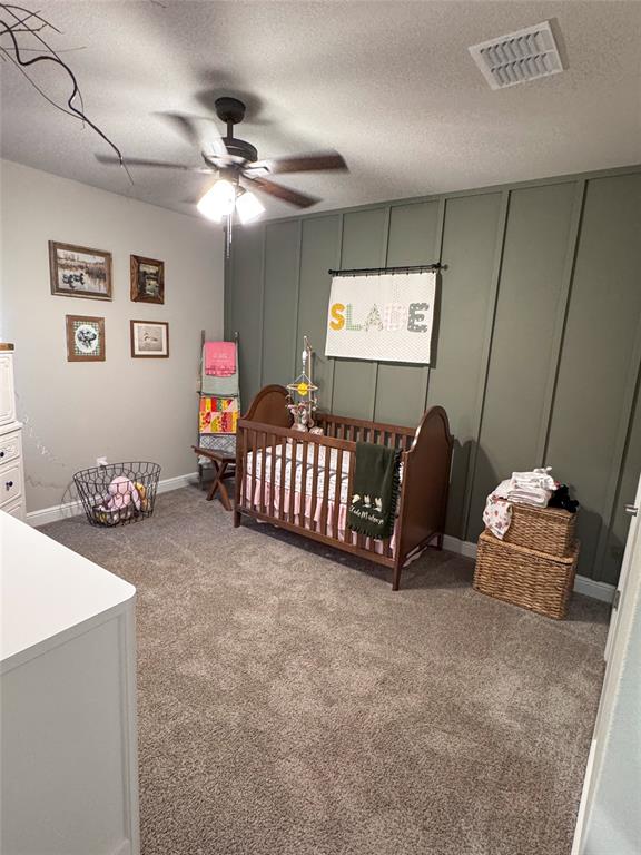 1908 Cookes Lane Cleburne, TX 76033 - Photo 10 of 17 Bedroom 4 featuring an accent wall and ceiling fan