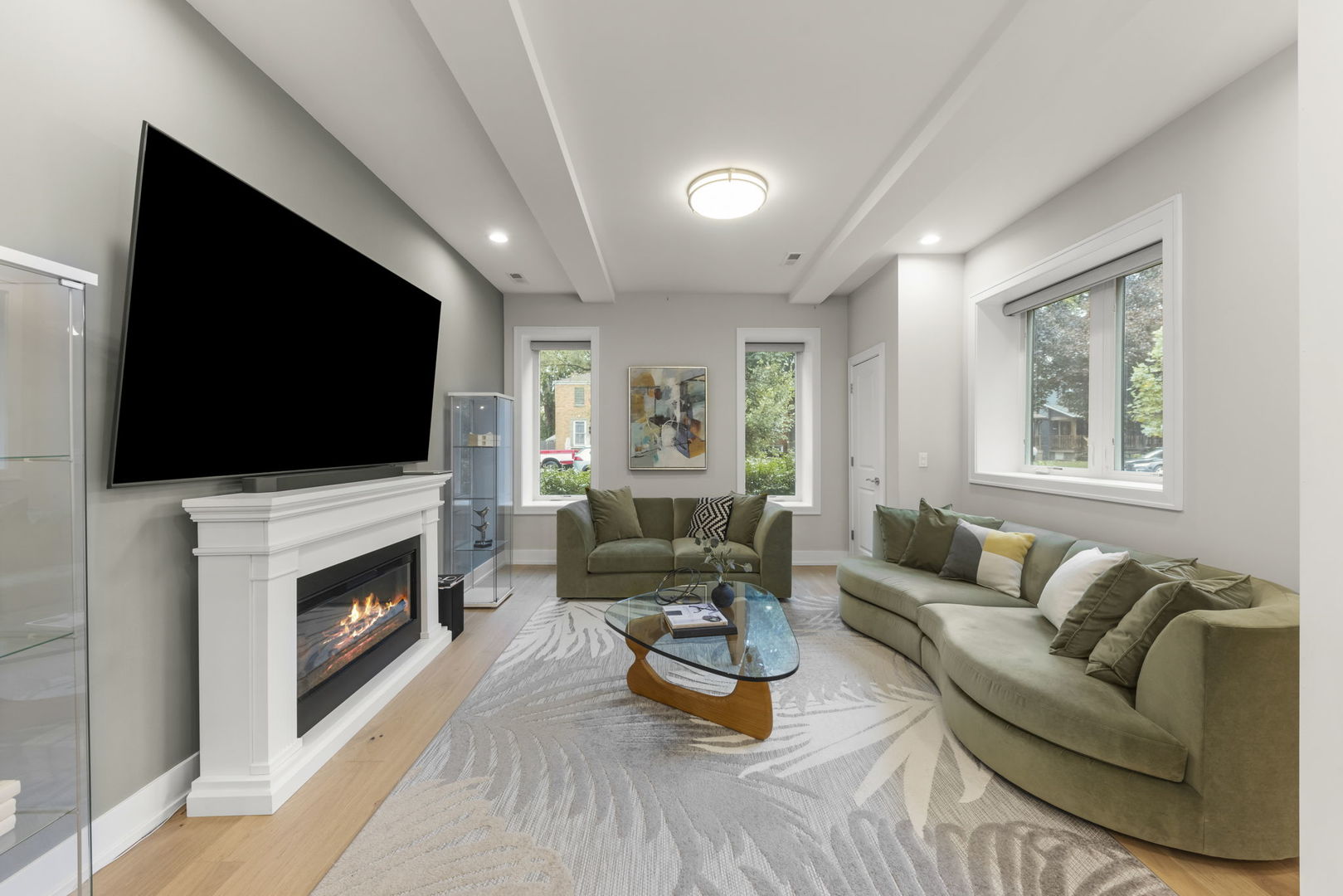 1126 Pitner Avenue Evanston, IL 60202 - Photo 16 of 48 a living room with furniture a flat screen tv a window and a fireplace