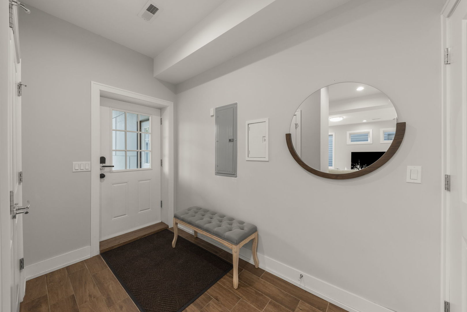 1126 Pitner Avenue Evanston, IL 60202 - Photo 19 of 48 an entryway and a mirror in a room