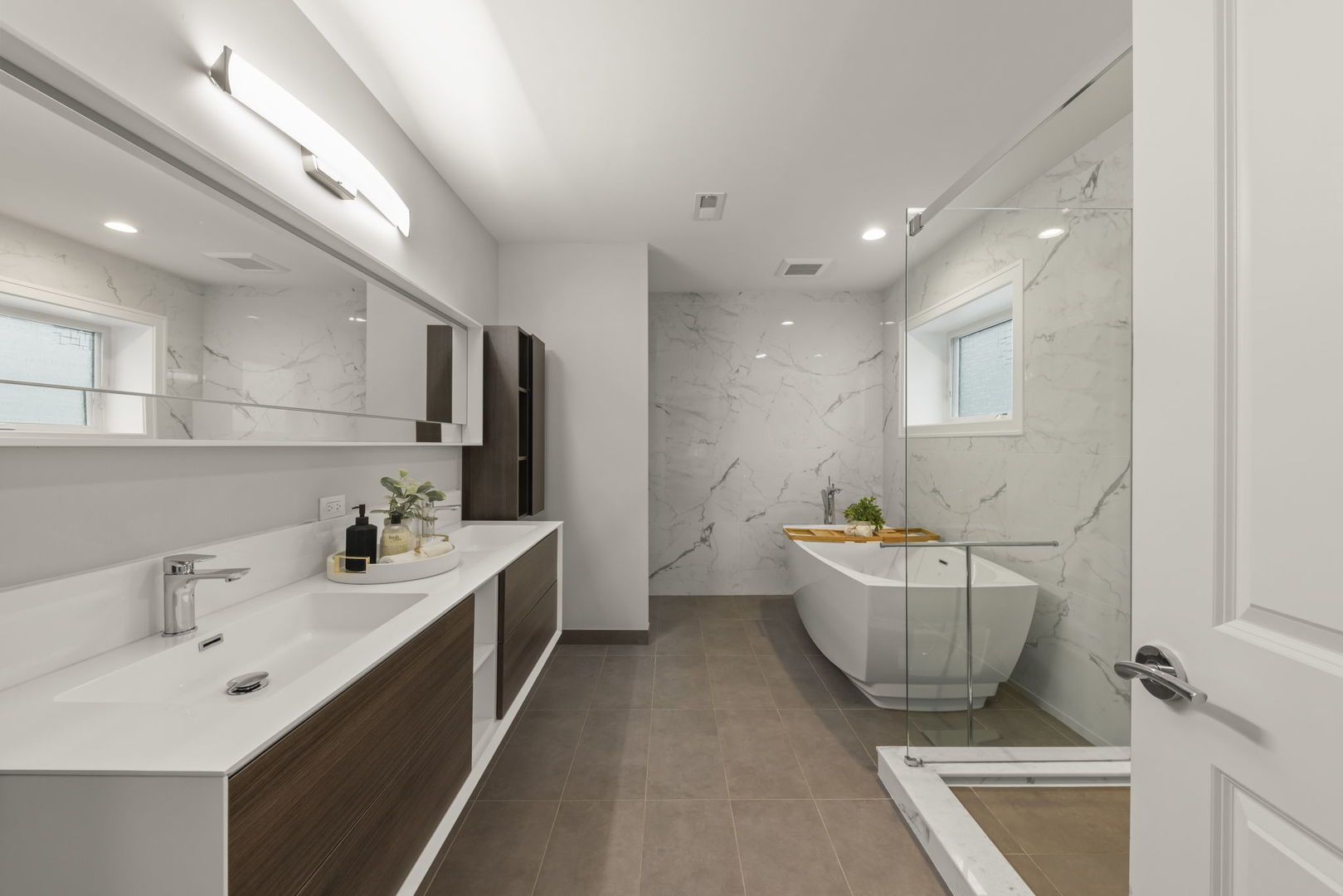 1126 Pitner Avenue Evanston, IL 60202 - Photo 23 of 48 a bathroom with a double vanity sink mirror and bathtub