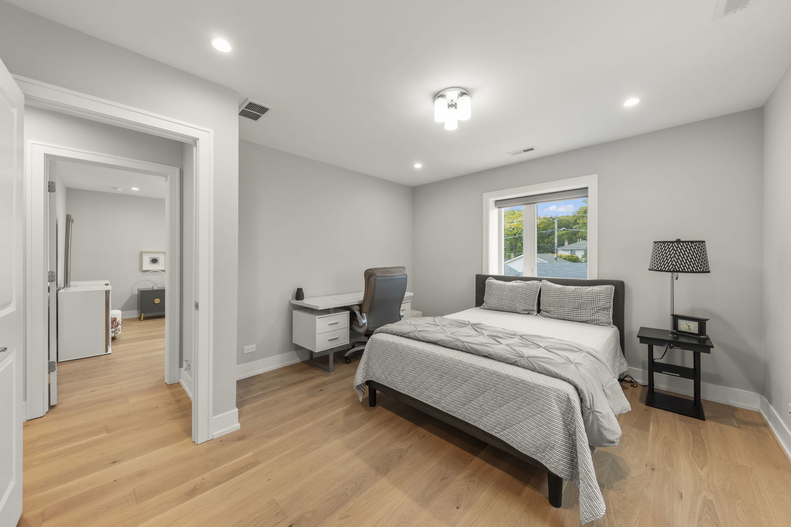 1126 Pitner Avenue Evanston, IL 60202 - Photo 29 of 48 a bedroom with a bed and a large mirror