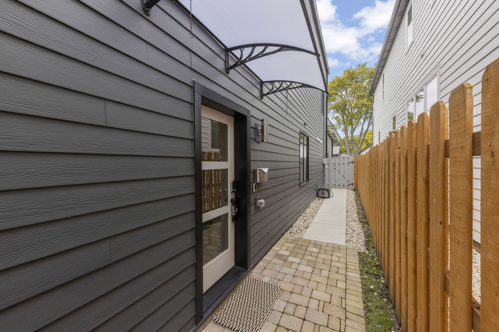 1126 Pitner Avenue Evanston, IL 60202 - Photo 3 of 48 a view of a pathway with a door