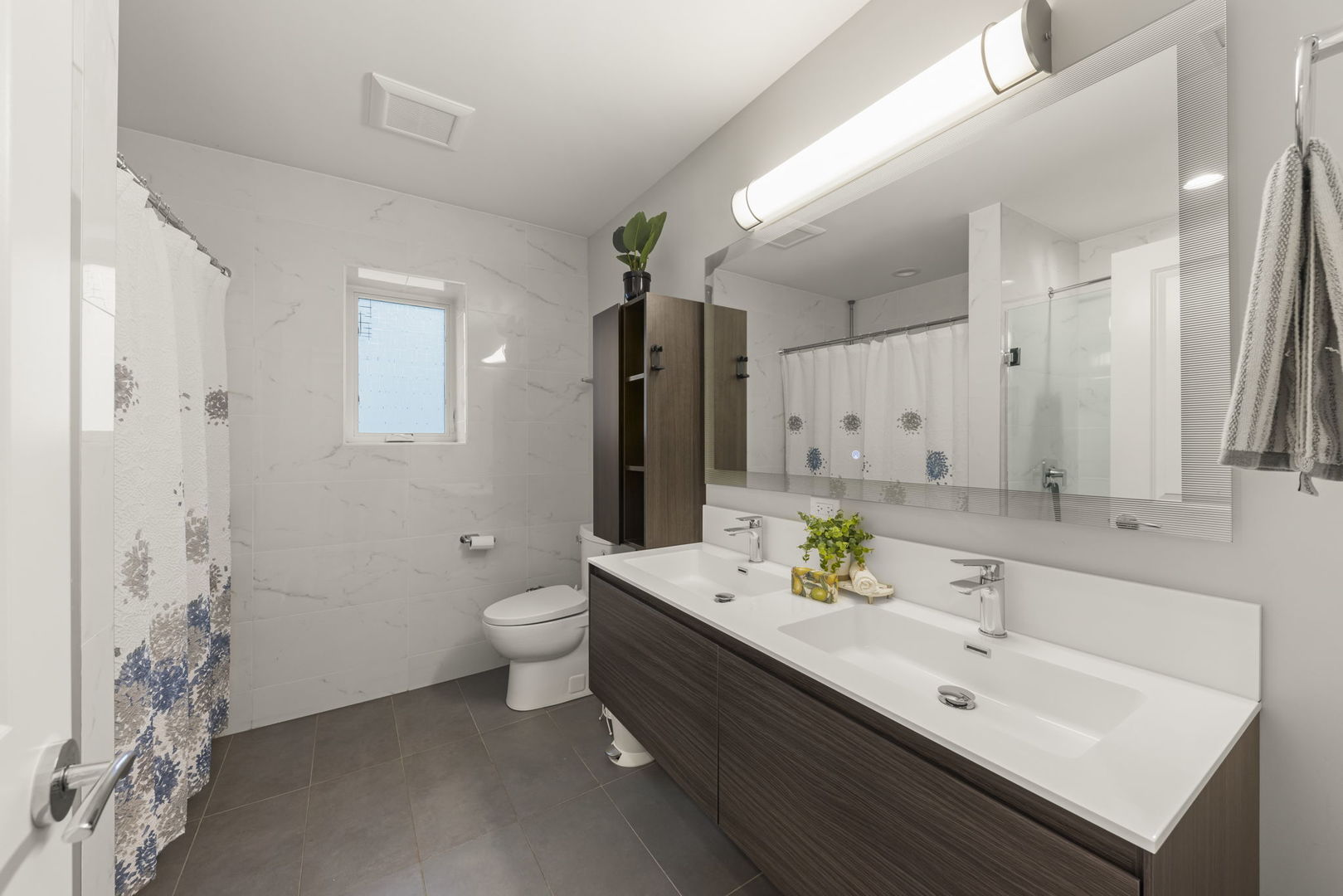 1126 Pitner Avenue Evanston, IL 60202 - Photo 31 of 48 a bathroom with a double vanity sink and a mirror