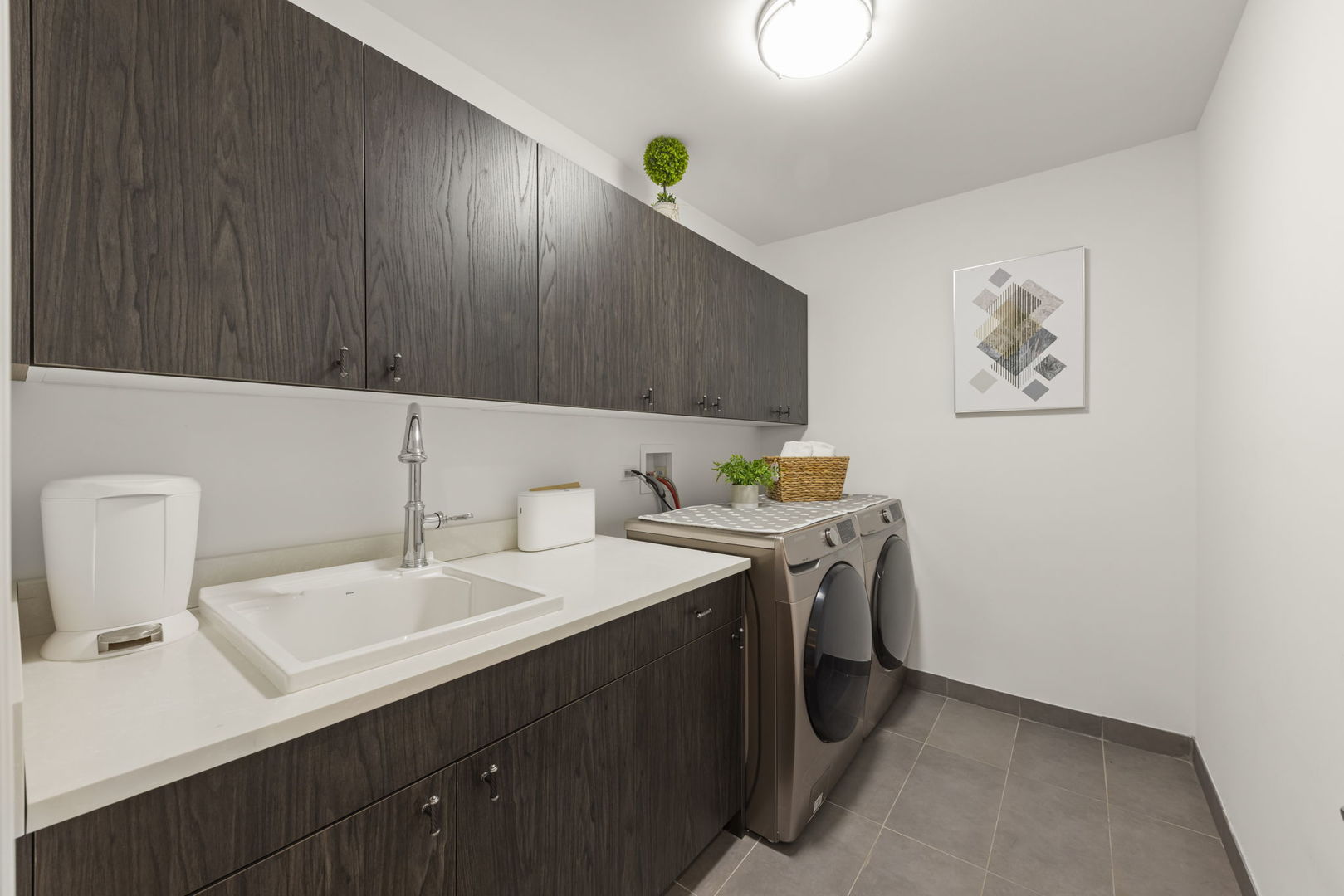 1126 Pitner Avenue Evanston, IL 60202 - Photo 32 of 48 a kitchen with a sink cabinets and wooden floor