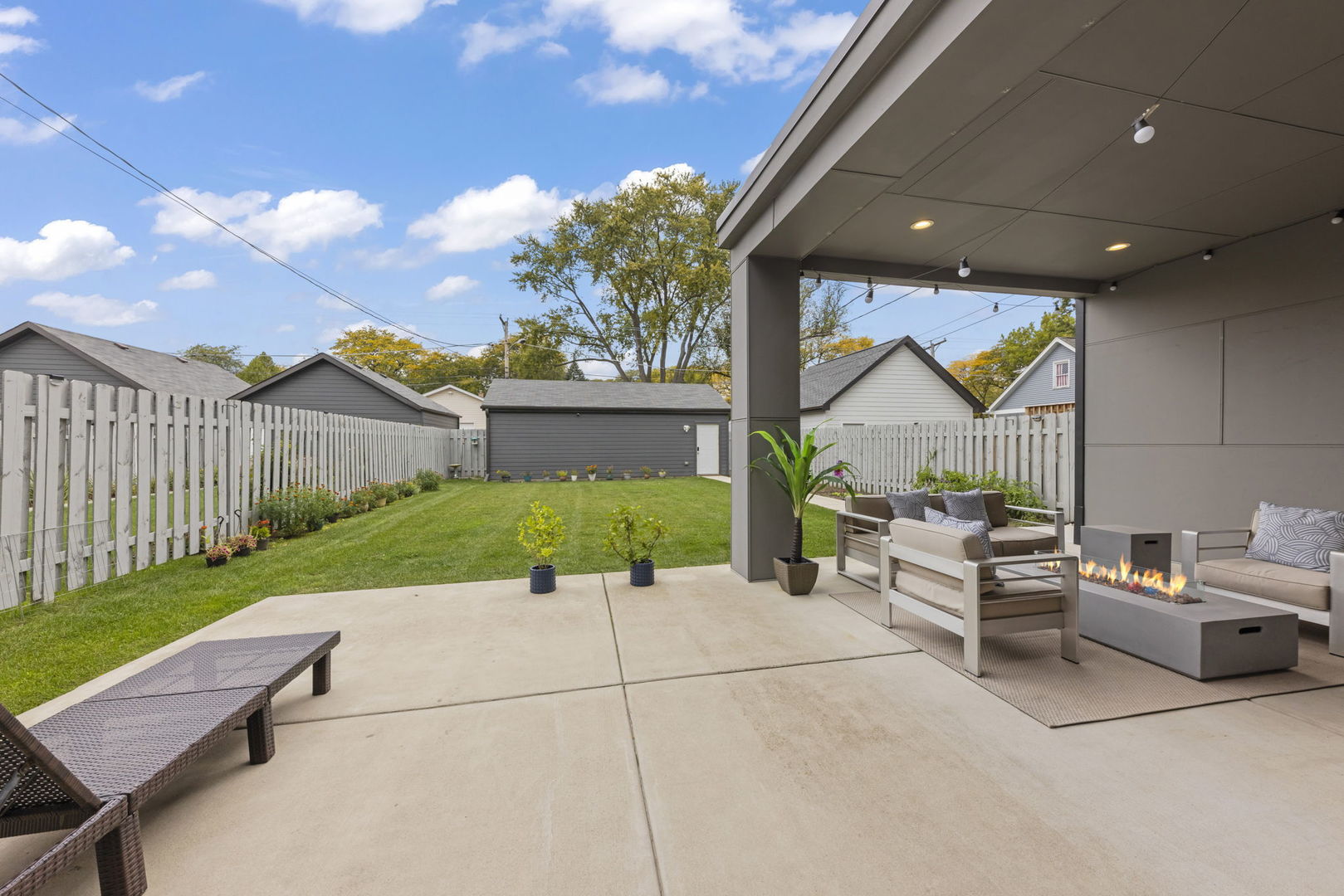 1126 Pitner Avenue Evanston, IL 60202 - Photo 35 of 48 a view of a patio with a dining table and chairs with wooden fence