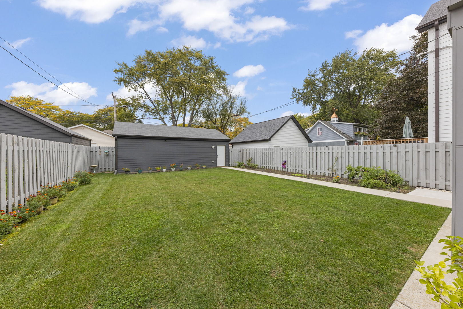 1126 Pitner Avenue Evanston, IL 60202 - Photo 36 of 48 a view of a house with a yard and a garden