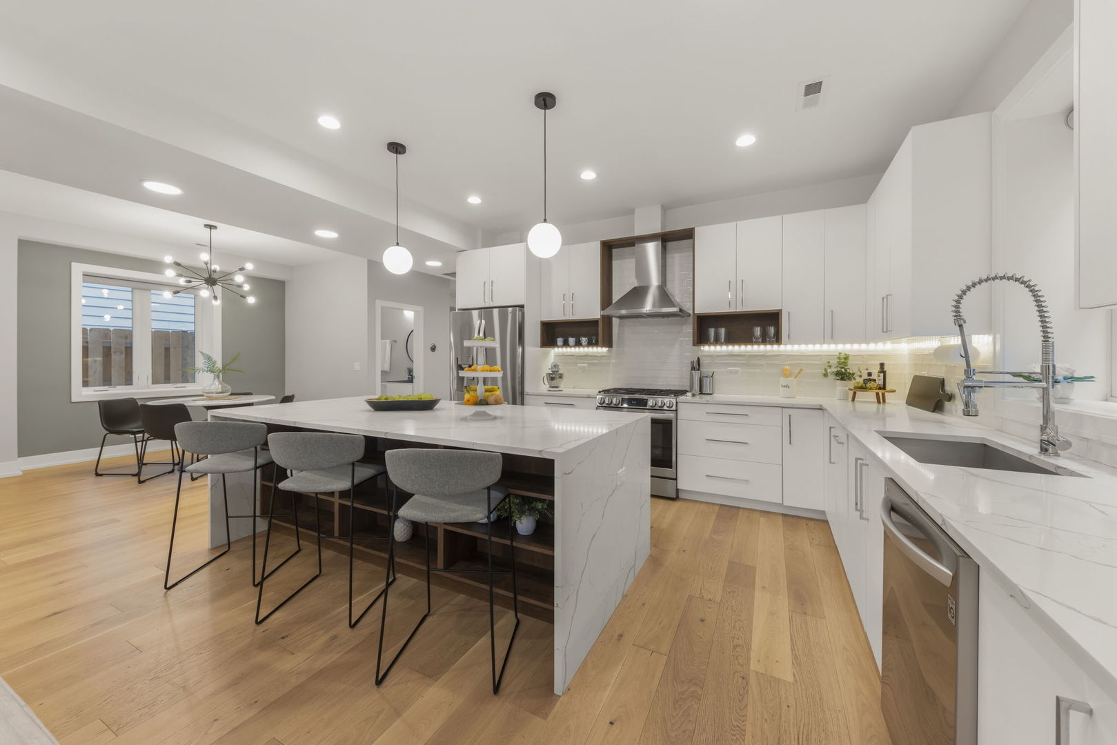 1126 Pitner Avenue Evanston, IL 60202 - Photo 9 of 48 a large kitchen with a table and chairs in it