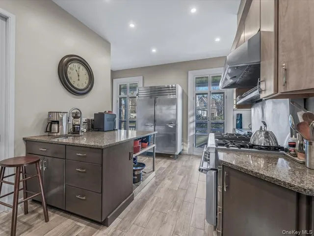 a kitchen with cabinets and stainless steel appliances