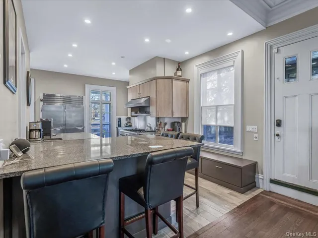 a view of a livingroom with furniture and a flat screen tv
