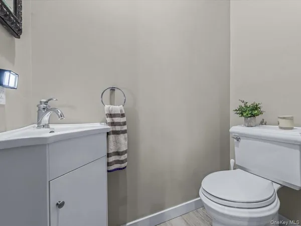 a bathroom with a sink a toilet and tub