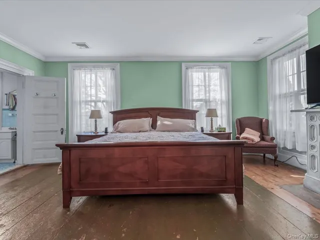 a view of a livingroom with furniture and wooden floor