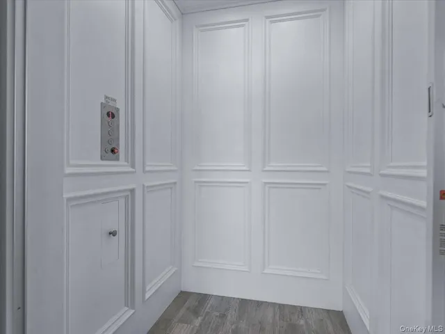 a room with pool table and windows