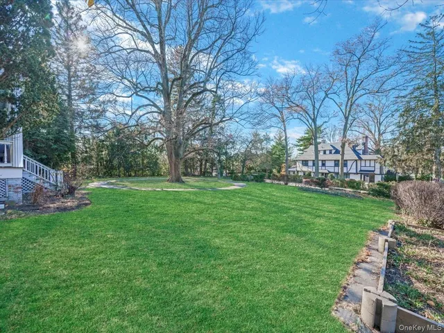 a view of a garden with a house