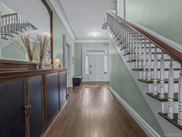 a view of staircase with wooden floor and staircase