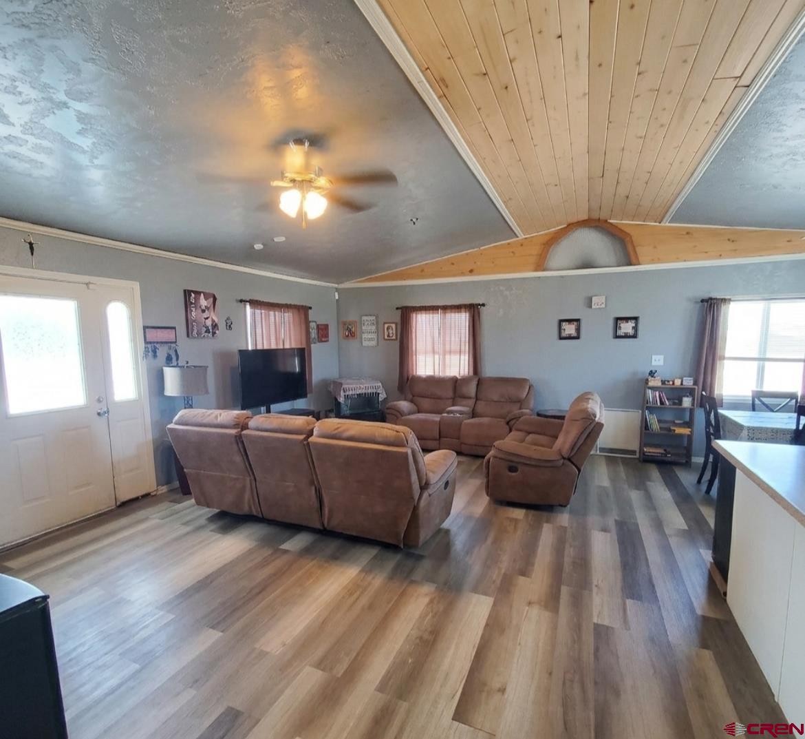 816 Main Street Manassa, CO 81141 - Photo 11 of 23 a living room with furniture and a wooden floor