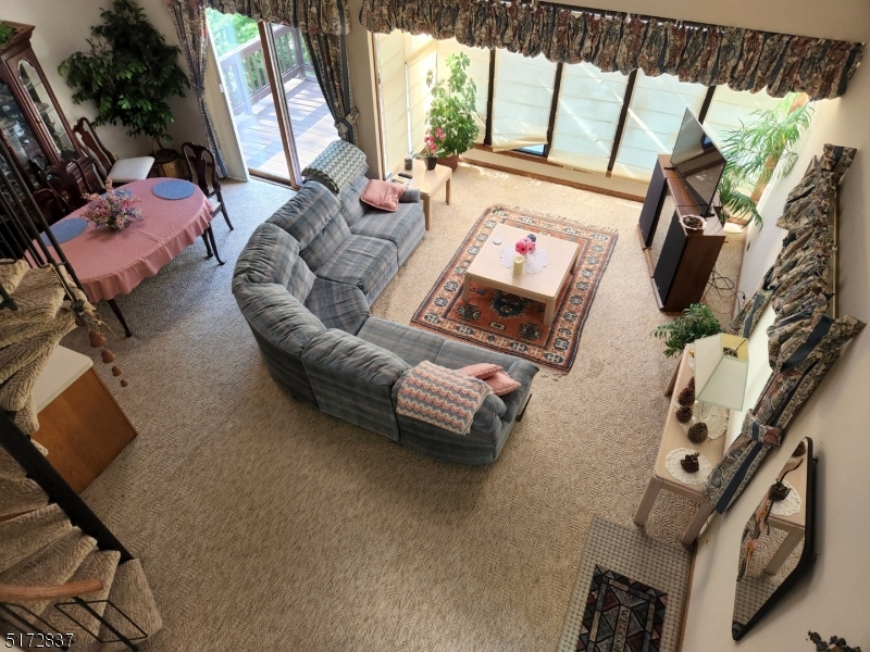 8 Acapulco Princess, Unit 2 Vernon, NJ 07462 - Photo 2 of 13 a living room with furniture and a flat screen tv