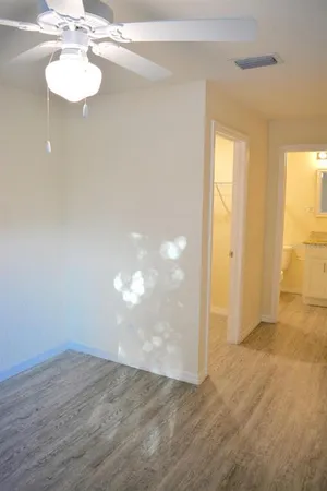 a view of an empty room with a window