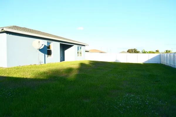 a view of swimming pool with a yard