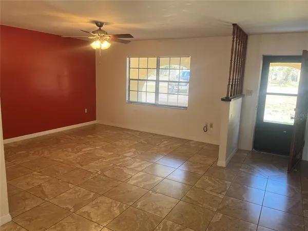 a view of an empty room with a window
